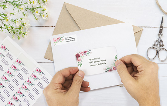 label-products-stock-labels-blank-labels-address-labels-enevelope-hands-applying-flowers-dls